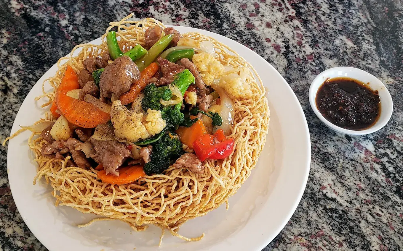Beef and Mixed Vegetables Stir Fry on Crispy Egg Noodles at Minh Chau Restaurant in Calgary, AB