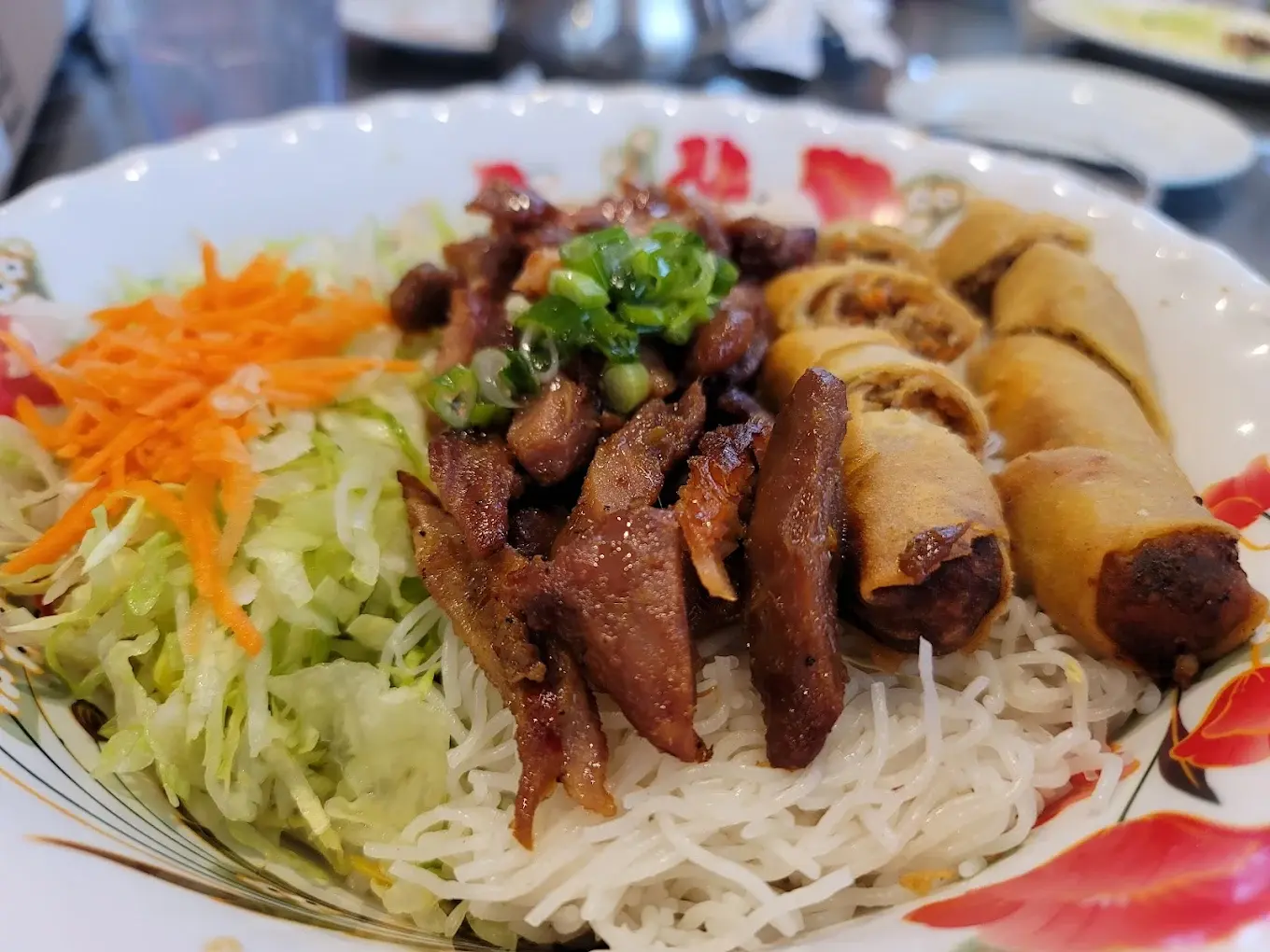 Lemongrass Chicken Vermicelli with Spring Roll at Minh Chau Restaurant in Calgary, AB